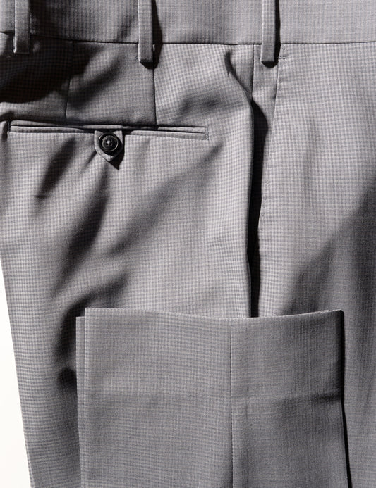 Detail shot of BKT50 Tailored Trousers in Subtle Mini Check - Light Gray showing hem and back pocket
