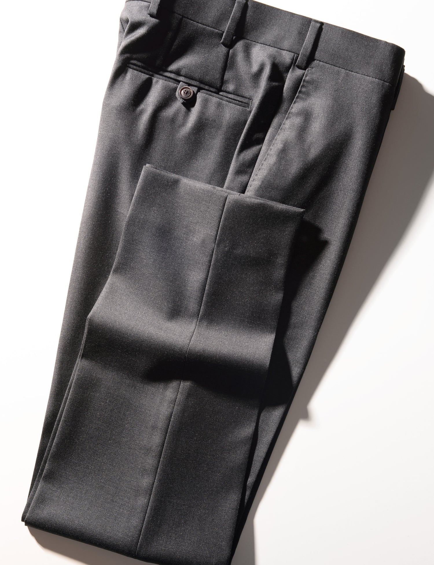 Detail shot of Brooklyn Tailors BKT50 Tailored Trouser in Super 110s Twill - Charcoal folded to show cuff, back pocket, side pocket, and waistband