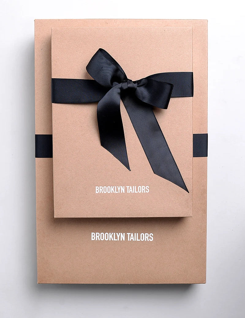 Photo of branded boxes wrapped in ribbon