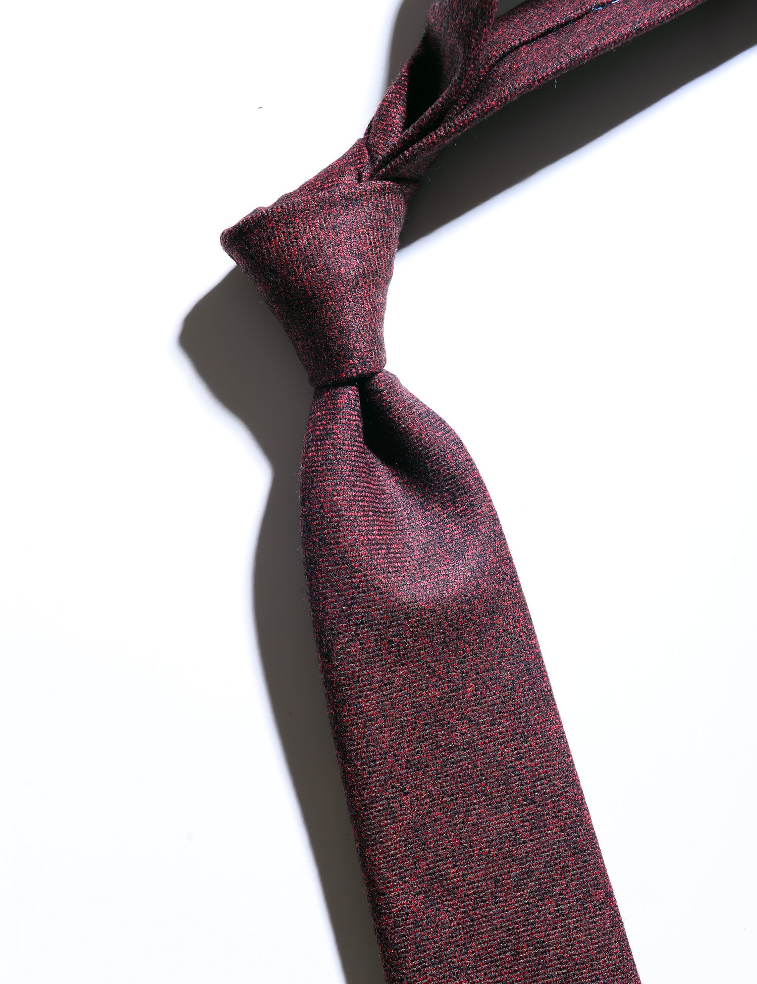 Detail of Wool Flannel Necktie in Amber Red showing fabric texture