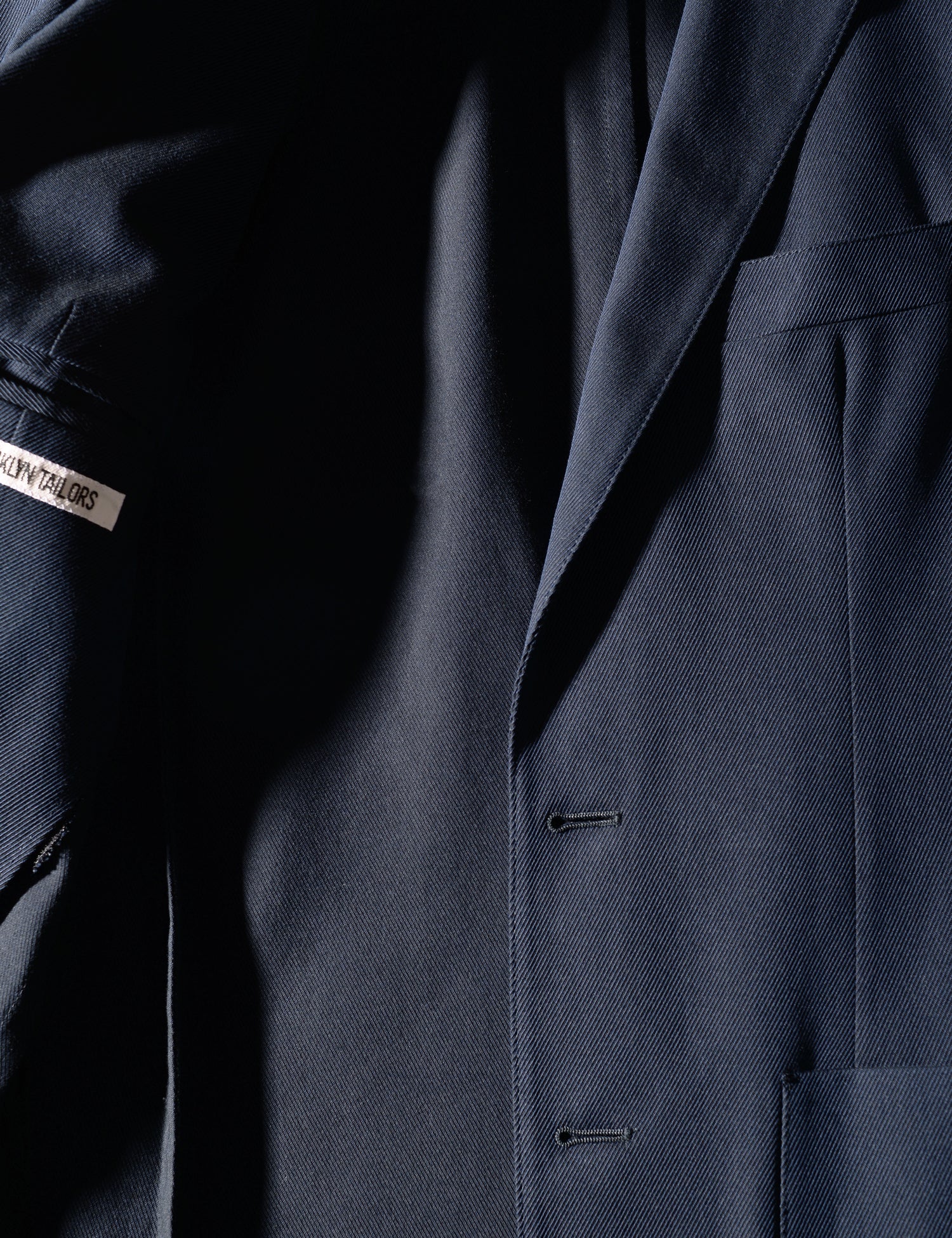 Detail shot of jacket opened showing interior labeling on Brooklyn Tailors BKT35 Unstructured Jacket in Cavalry Twill - Navy