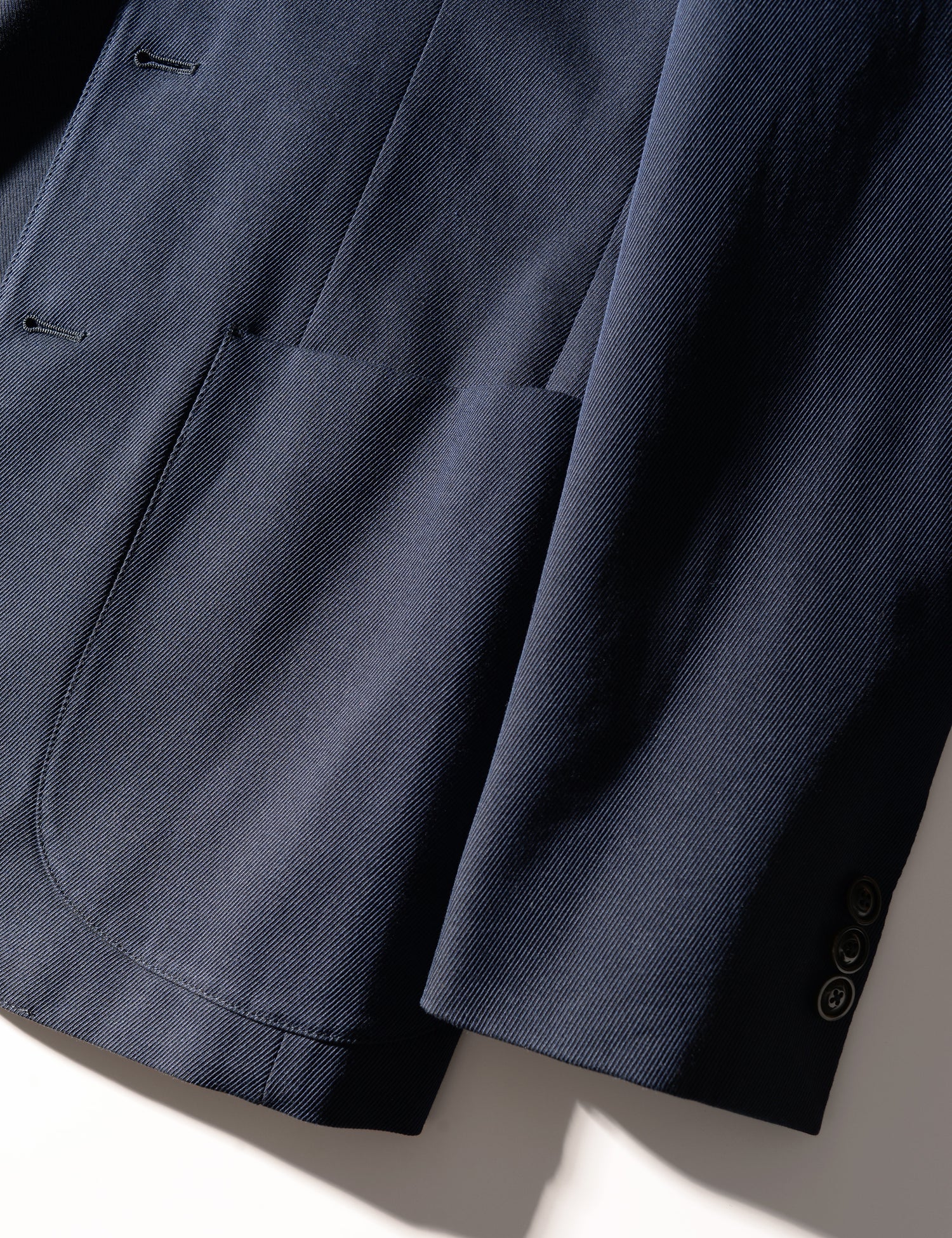 Detail shot showing cuff and patch pocket on Brooklyn Tailors BKT35 Unstructured Jacket in Cavalry Twill - Navy