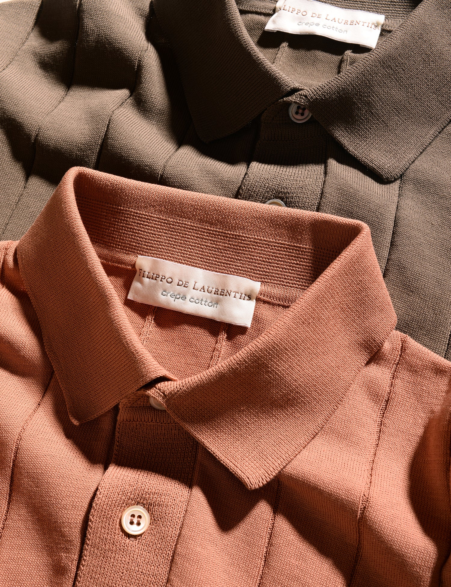Close-up of two colors of Filippo de Laurentiis crepe cotton ribbed polos showing the colors and collars
