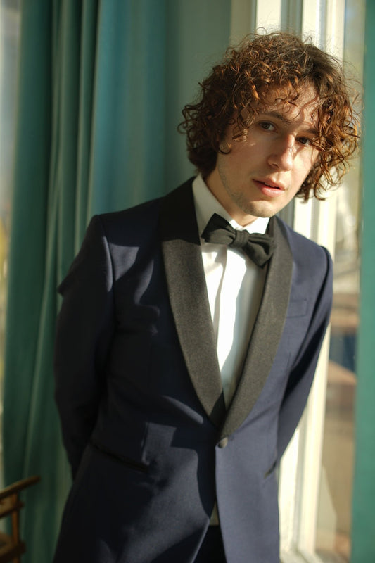 Brooklyn Tailors BKT50 Shawl Collar Tuxedo Jacket in Wool / Mohair - Ink Blue with Grosgrain Lapel on-body shot. Model is wearing jacket with a white tuxedo shirt and black bowtie