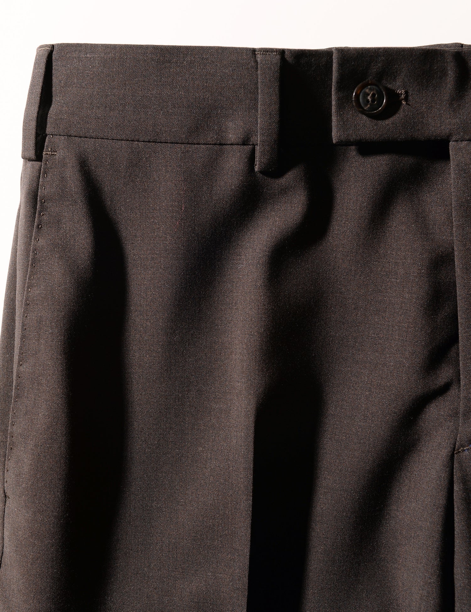 Detail shot of Brooklyn Tailors BKT50 Tailored Trousers in Heathered Plainweave - Charred Ember showing waistband and fabric texture