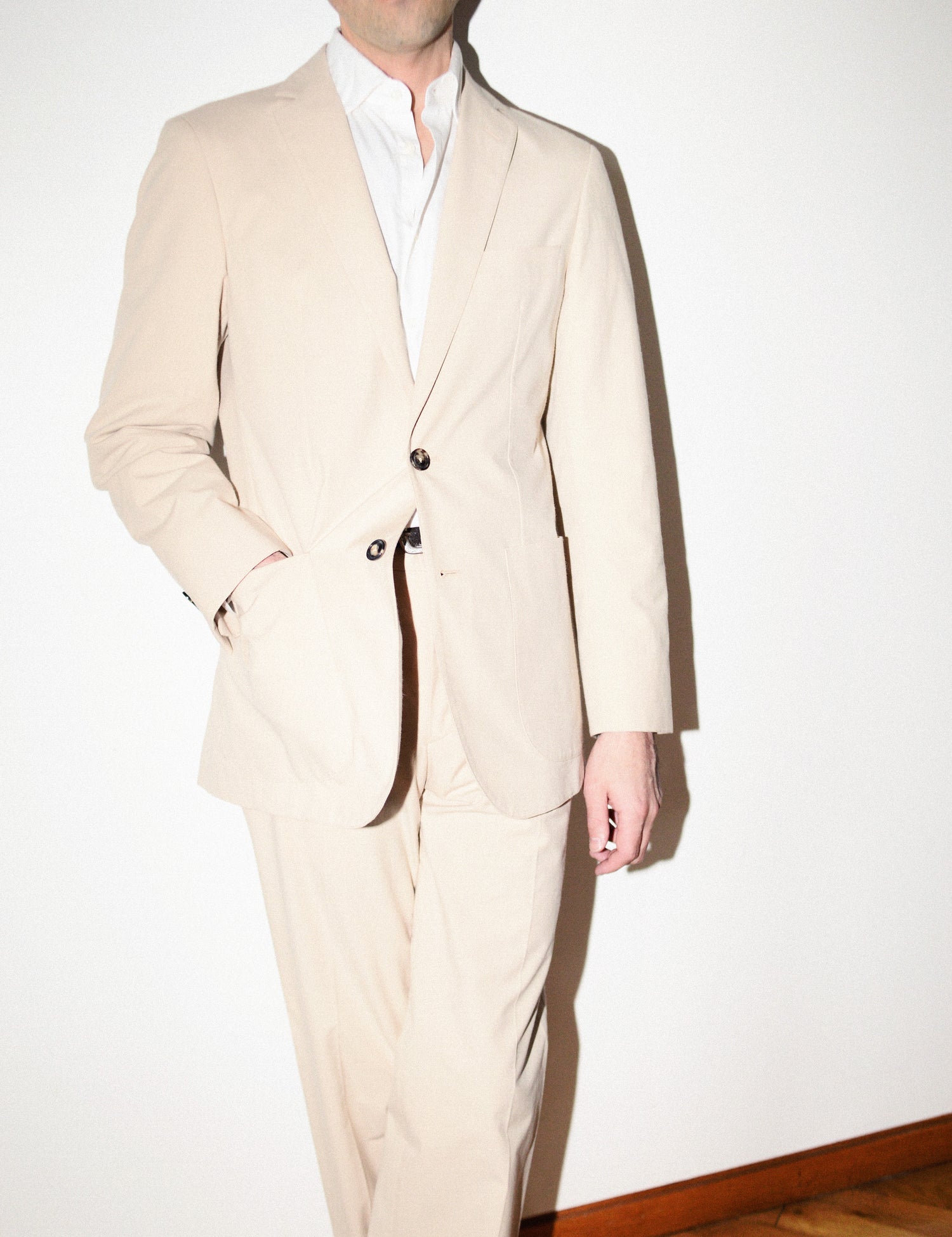 Brooklyn Tailors BKT36 Straight Leg Pant in Crisp Cotton Blend - Desert Sand on-body shot. Model is wearing the pants with a matching jacket and white dress shirt