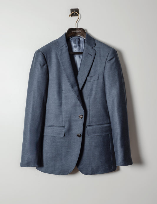 Image of BKT50 Tailored Jacket in Super 130s Heather Twill - Cool Blue on hanger against a white backdrop