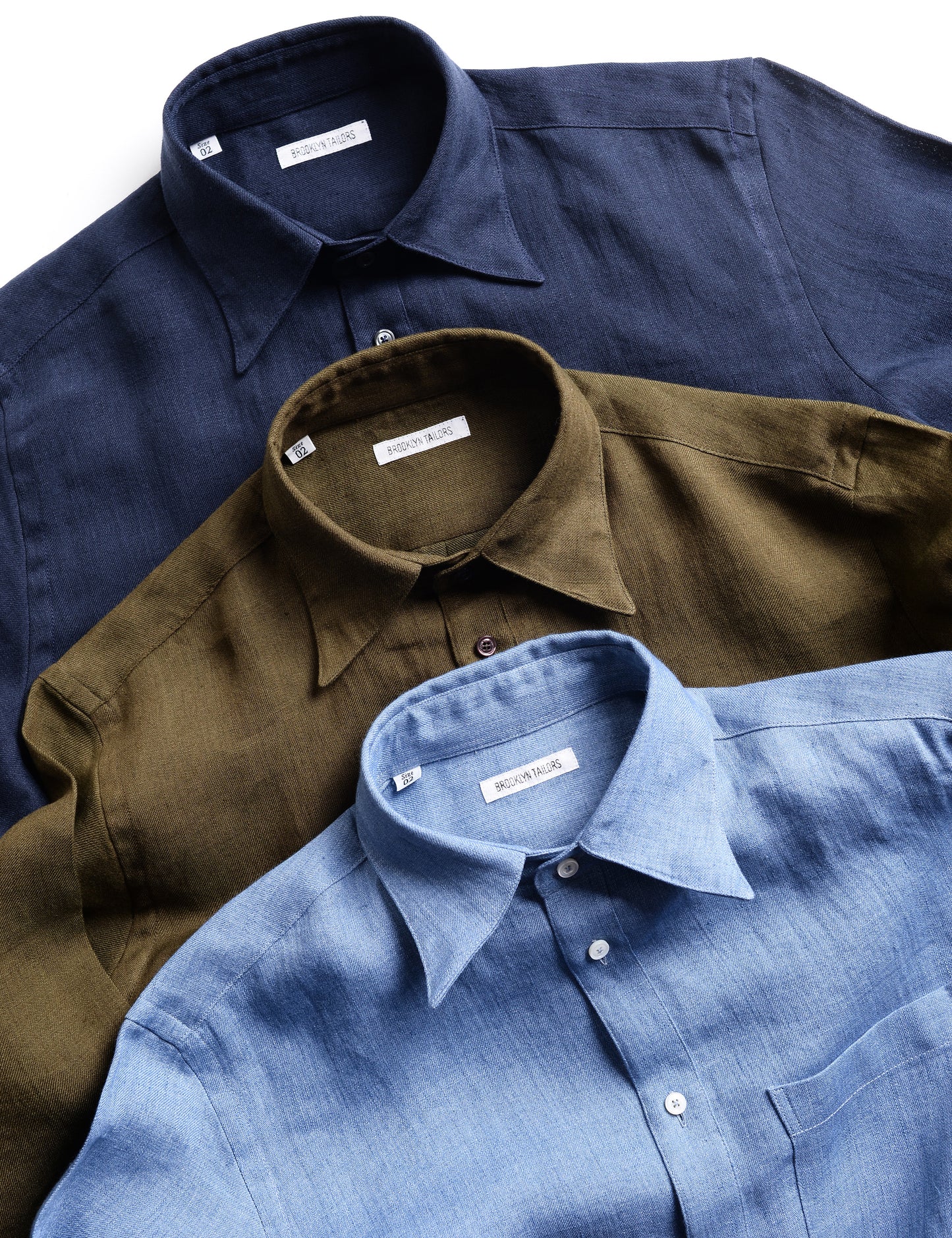 Collar shot of three colors of Brooklyn Tailors Relaxed Casual Shirts in Linen Twill 