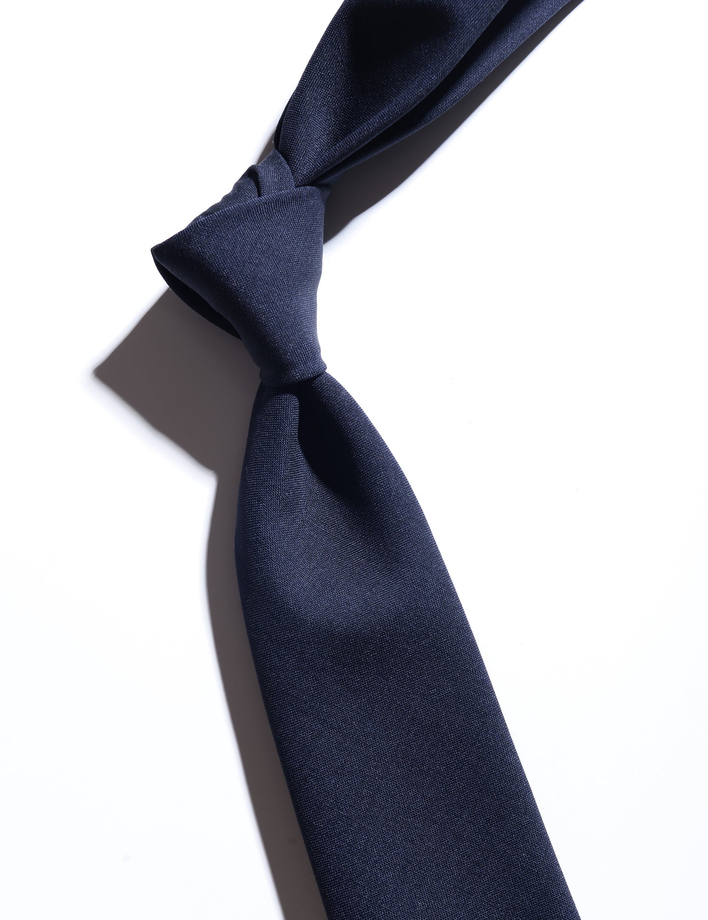 Detail of Super Fine Wool & Mohair Necktie - Midnight Blue showing fabric texture