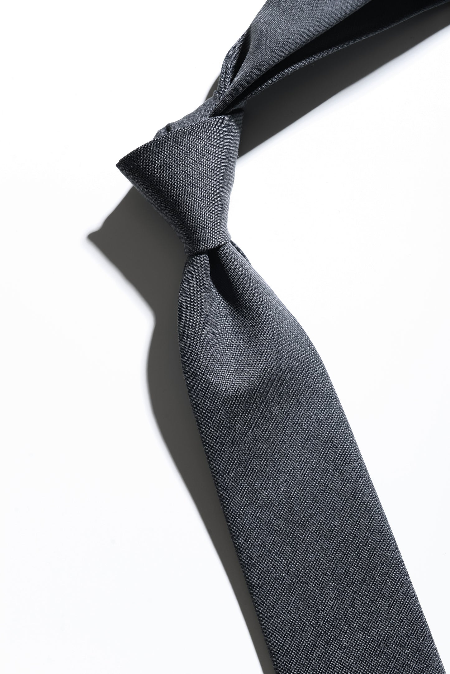 Detail of Super Fine Wool & Mohair Necktie - Petrol Gray showing fabric texture
