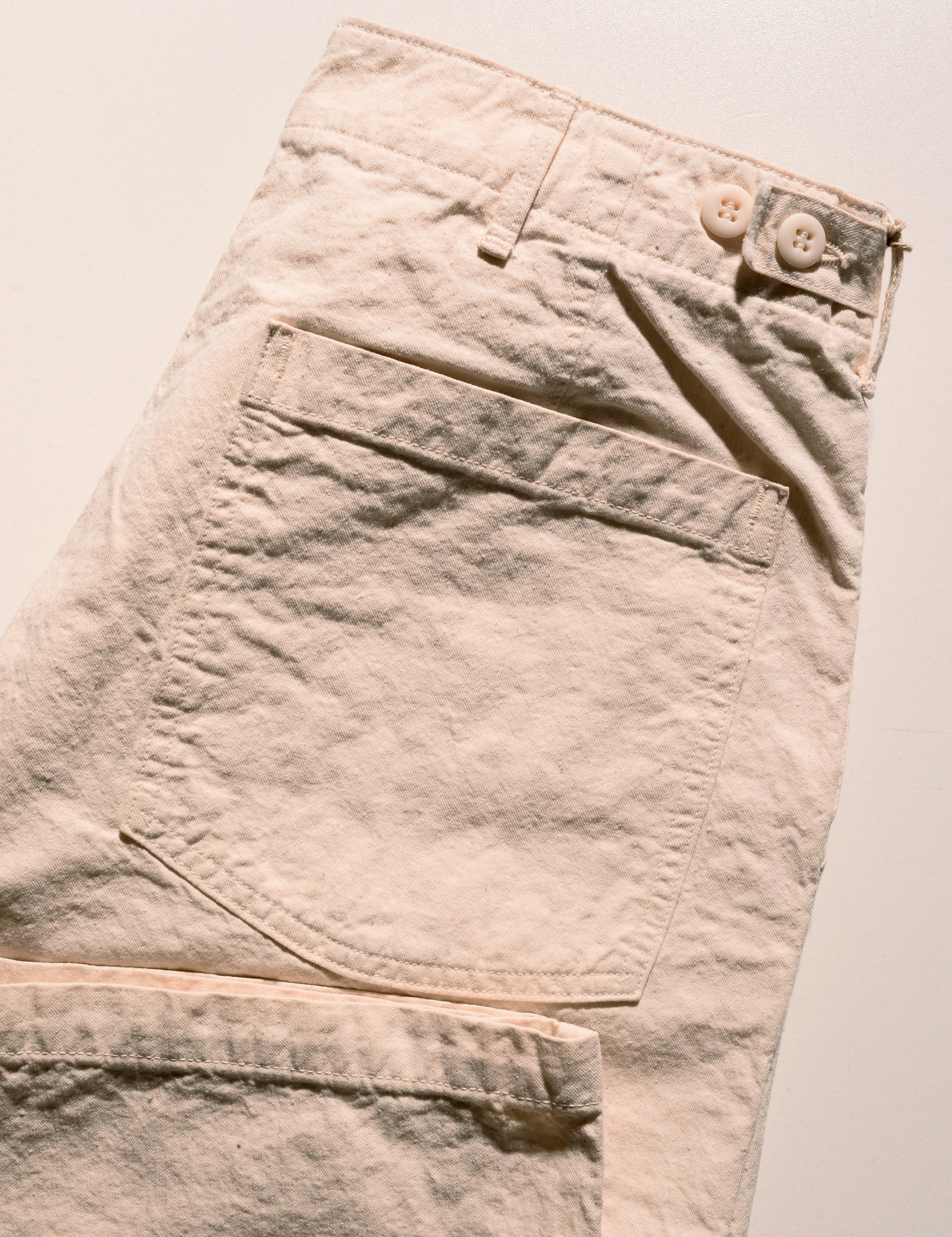 Detail shot of Orslow Original Napped Twill Summer Fatigue Pants - Ecru showing back pocket and side adjuster