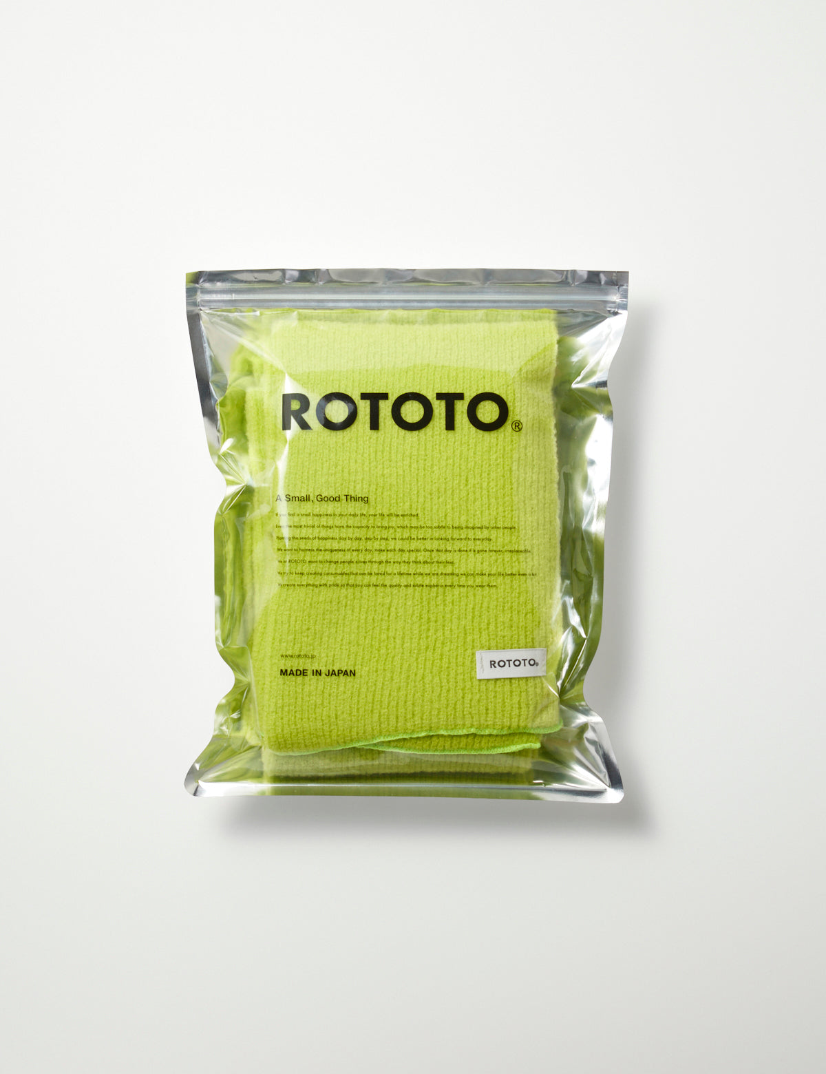 Photo of Merino Boucle Scarf - Lime in clear packaging