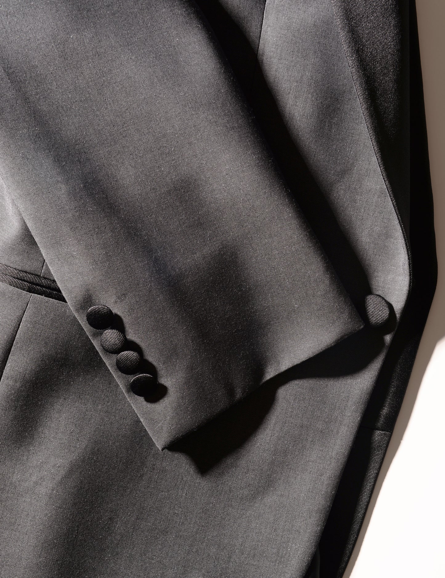 Detail shot of Brooklyn Tailors BKT50 Shawl Collar Dinner Jacket in Wool & Mohair - Gunmetal Gray showing sleeve with covered buttons