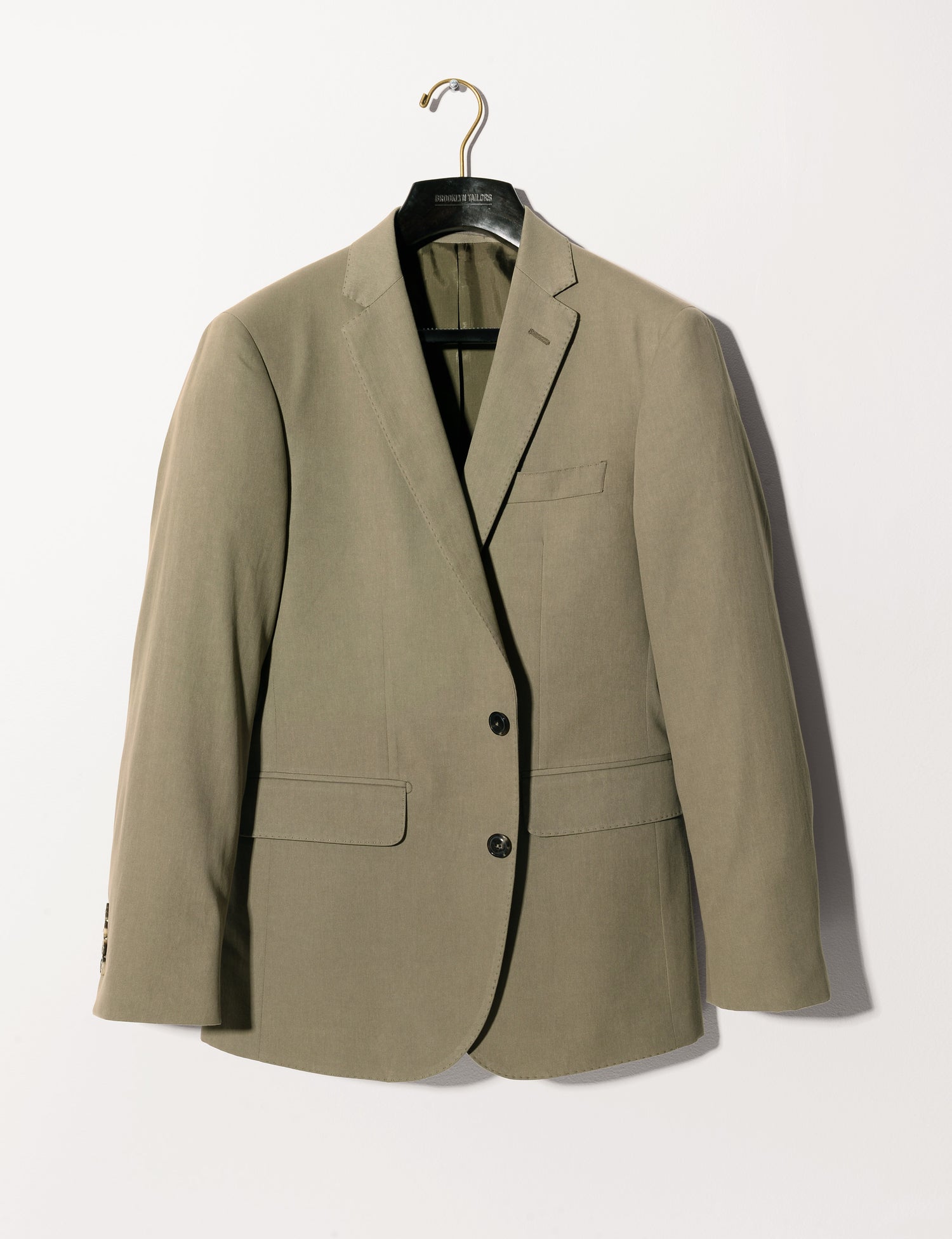 Brooklyn Tailors BKT50 Tailored Jacket in Cotton / Kapok Twill - Sonoran Green full length shot on hanger