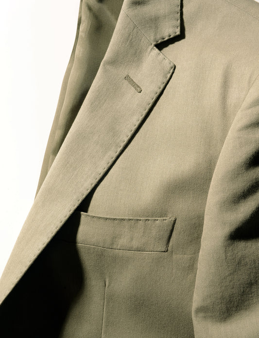 Detail shot of Brooklyn Tailors BKT50 Tailored Jacket in Cotton / Kapok Twill - Sonoran Green showing lapel, chest pocket, lining, and fabric texture
