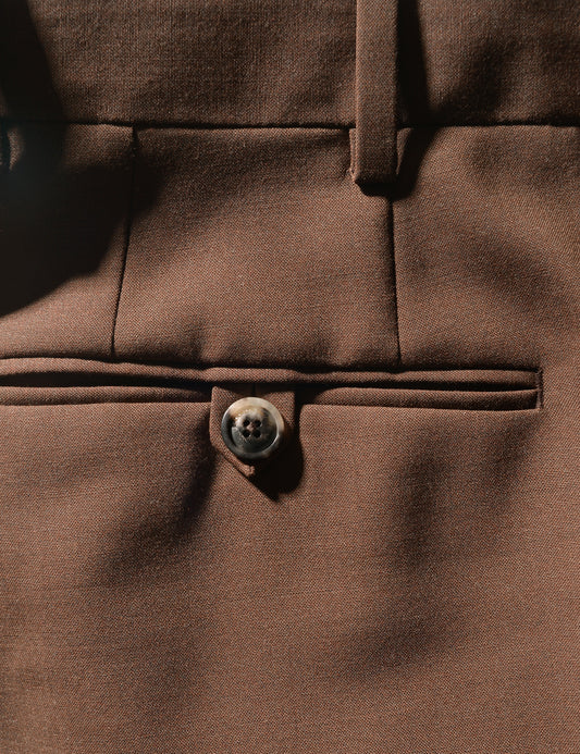 Detail shot of Brooklyn Tailors BKT50 Tailored Trousers in Heathered Plainweave - Tawny Brown showing back pocket and fabric texture
