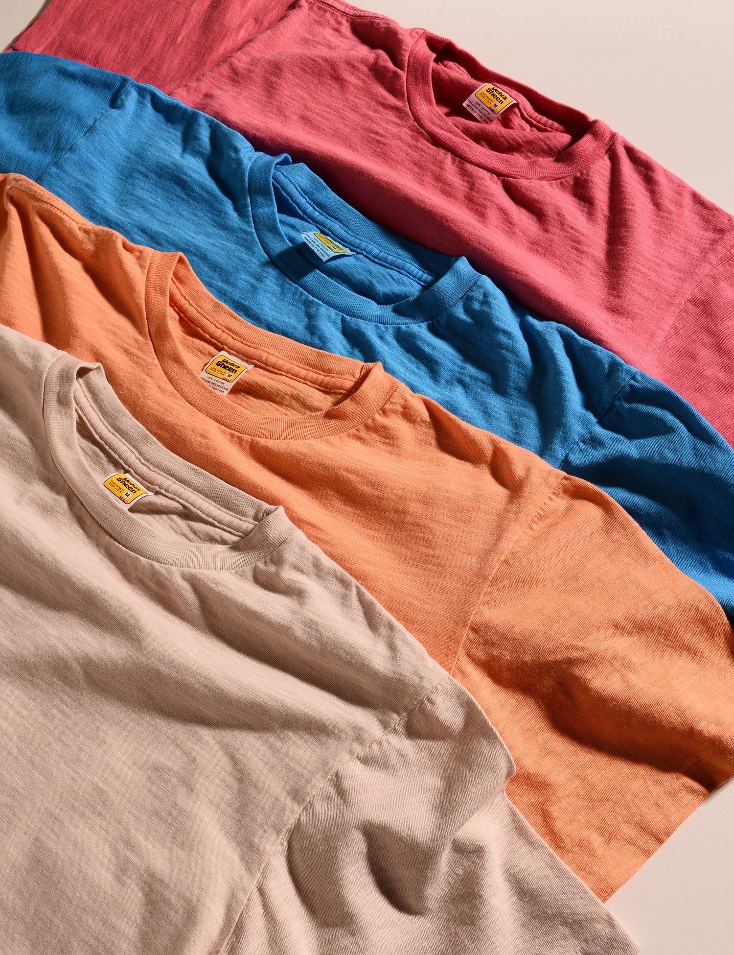 Shot of all of the seasonal colors of Velva Sheen crewneck t-shirts