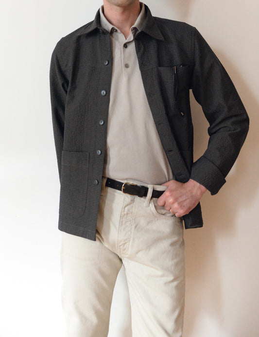 Brooklyn Tailors BKT15 Shirt Jacket in Crinkled Wool & Cotton - Storm on-body shot. Model is wearing gray polo shirt, cream corduroys, a dark brown belt with the shirt jacket.