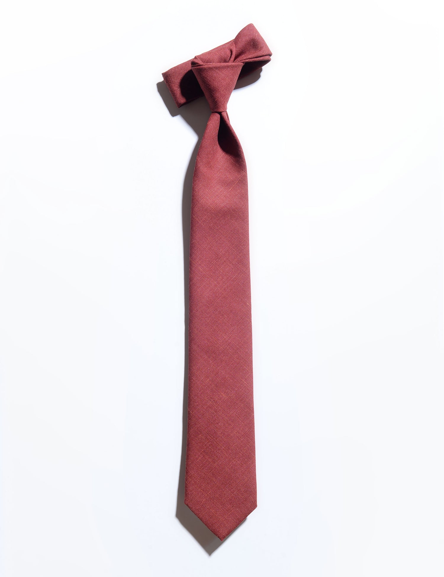 Flat shot of Brooklyn Tailors Wool Silk/Linen Tropical Tie in Sienna Red