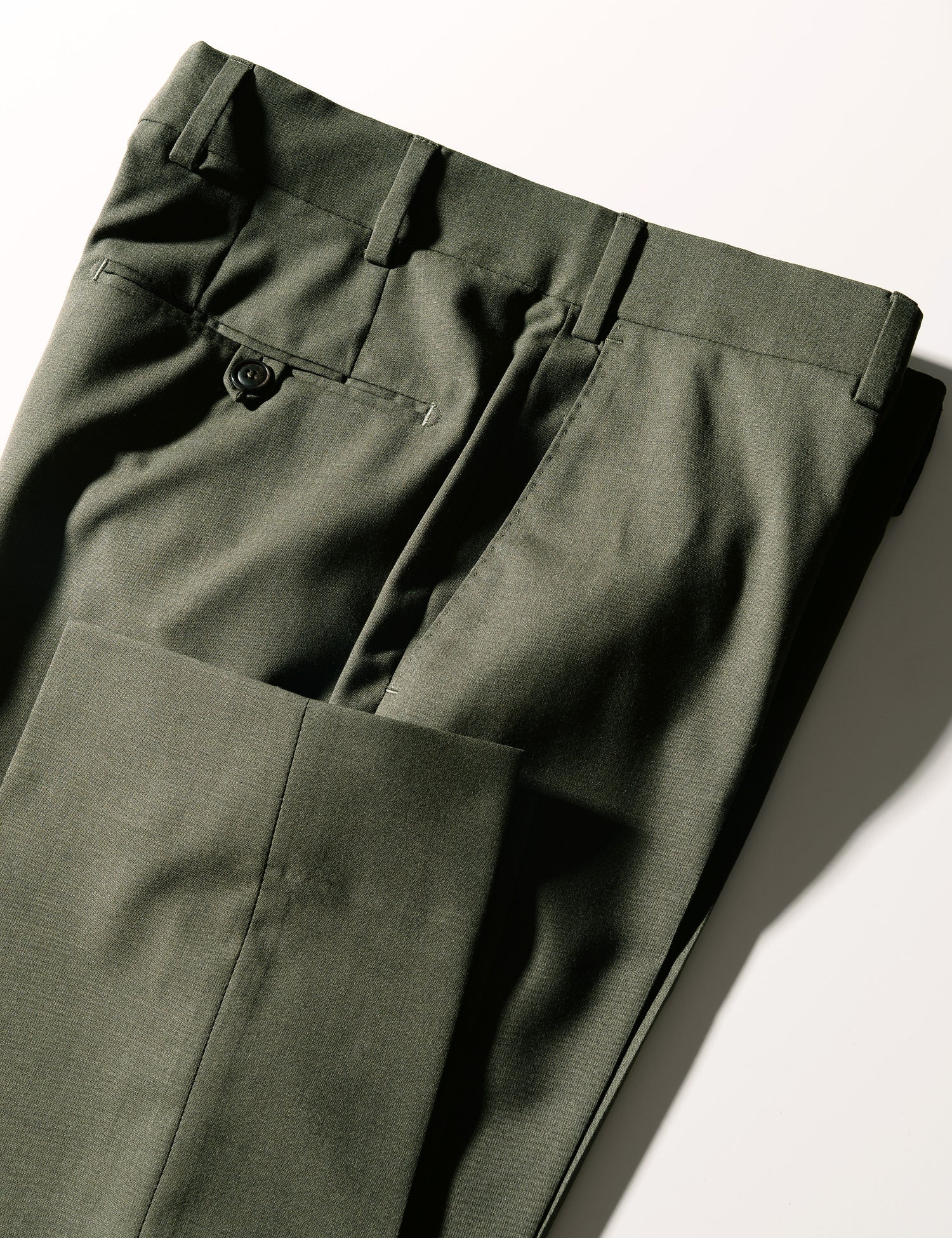 Detail shot of Brooklyn Tailors BKT50 Tailored Trousers in 14.5 Micron Mouliné - Agave Green showing cuff, back pocket, side pocket and waistband