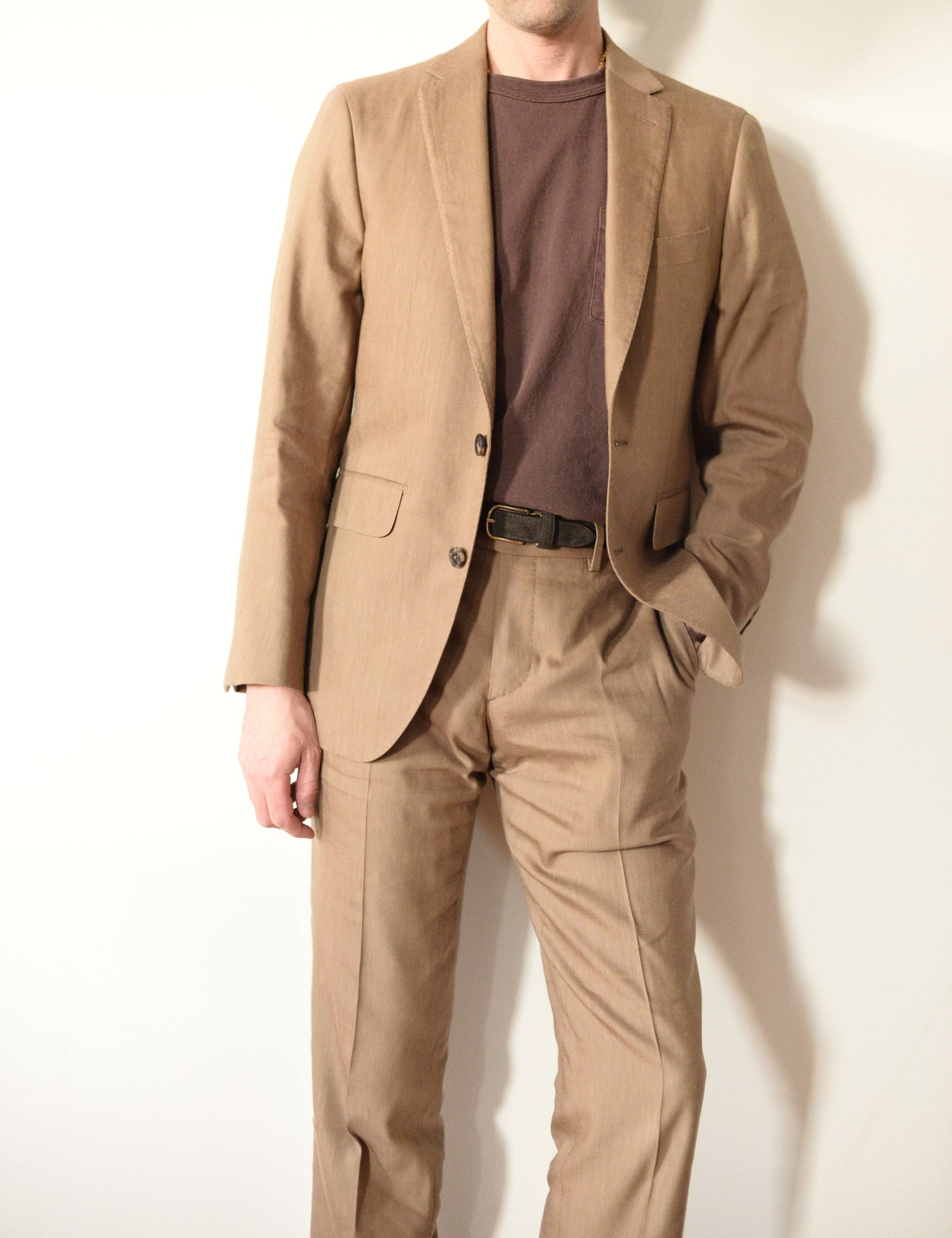 Brooklyn Tailors BKT50 Tailored Jacket in Wool Linen - Sahara on-body shot. Model is wearing jacket with matching trouser, brown t-shirt, and brown belt. 
