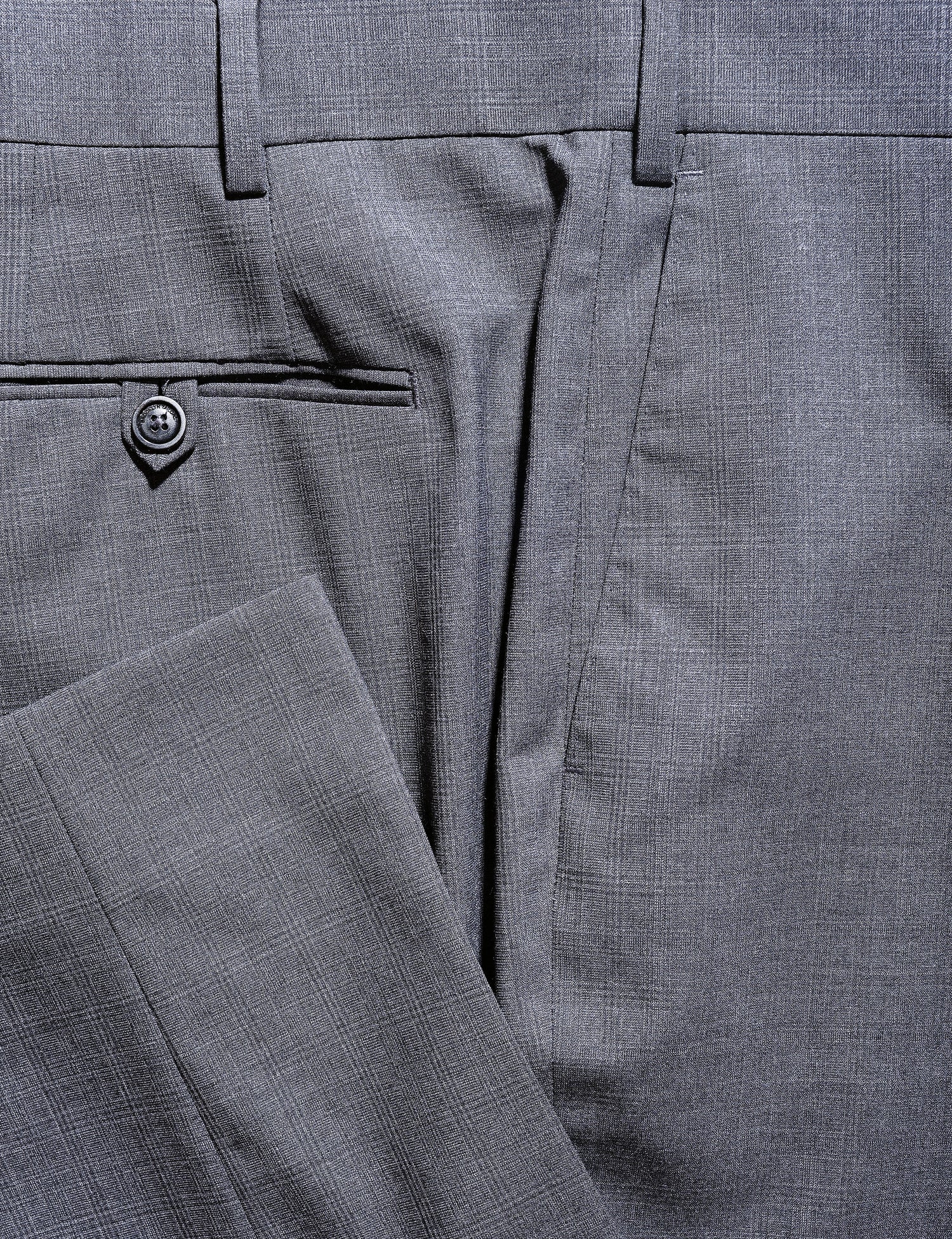 Detail of BKT50 Tailored Trousers in Tropical Wool - Gray Plaid showing hem, back pocket, and fabric pattern