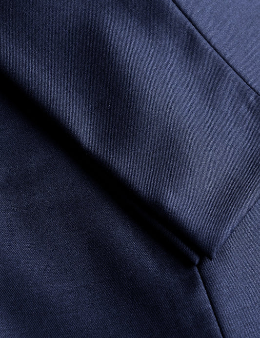 Detail of BKT50 Tailored Trouser in Super 120s Twill - Midnight Blue showing hem and fabric texture
