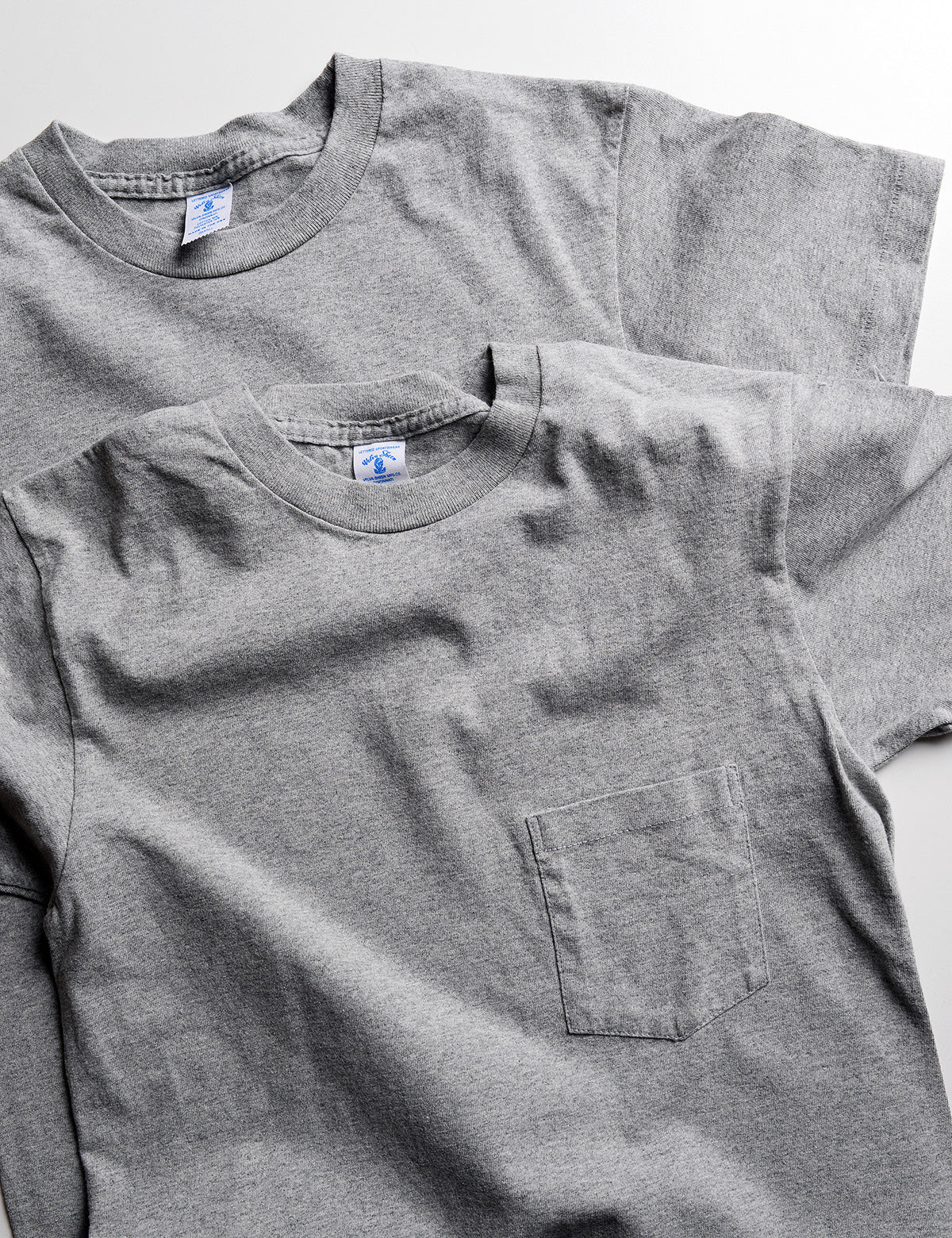 Slightly cropped and casual photo of 2-Pack Short Sleeve Pocket Tee in Heather Gray