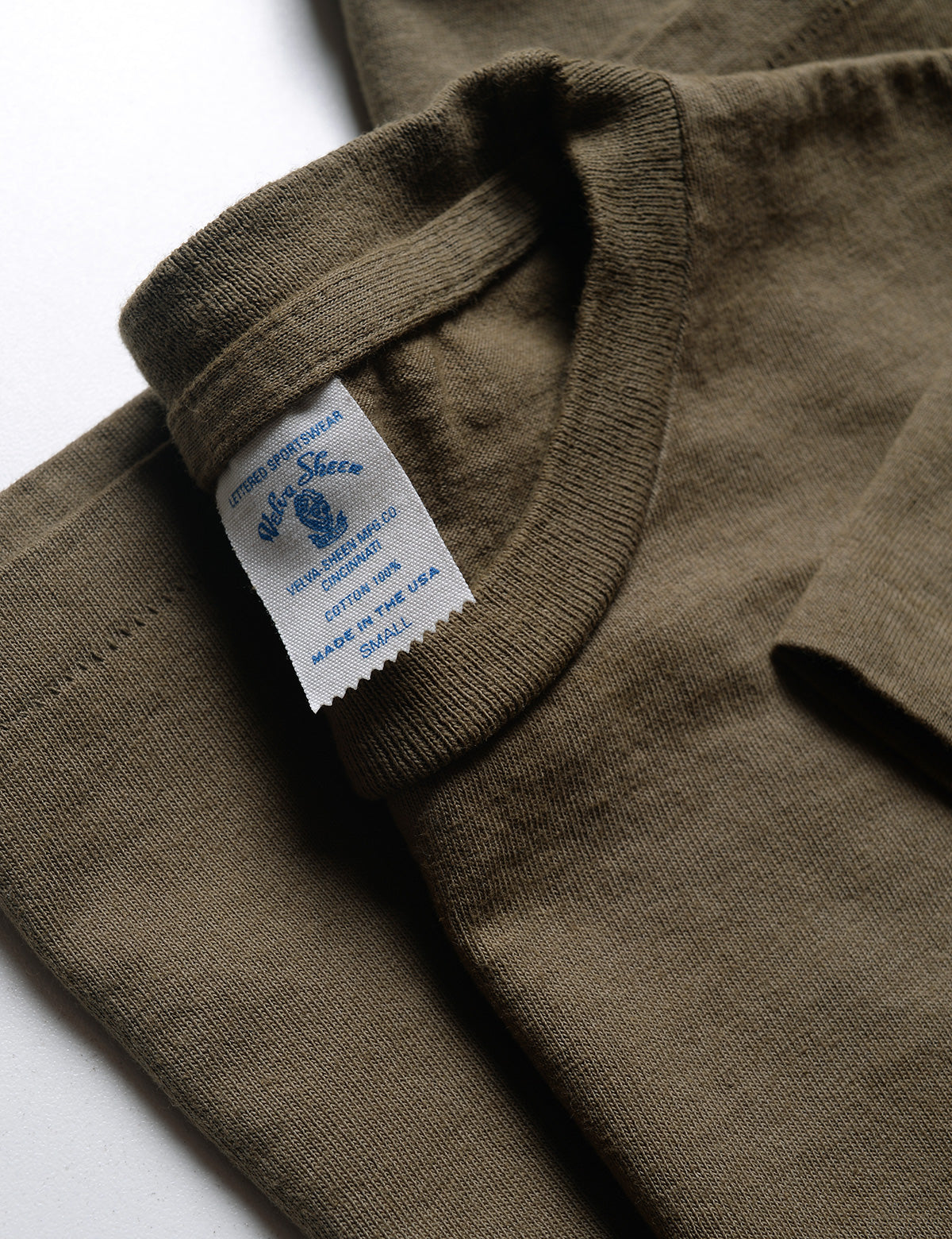 Close-up of neck and label of Velva Sheen 2-Pack Short Sleeve Pocket Tee in Olive