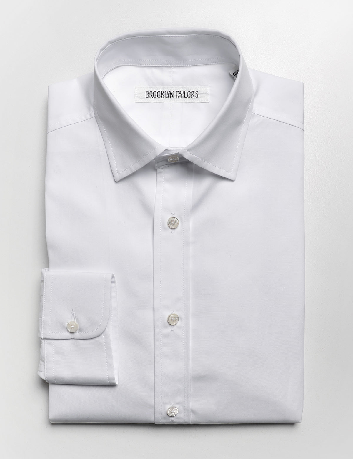 Brooklyn Tailors BKT20 Slim Dress Shirt in Crisp Poplin - White folded flat shot
