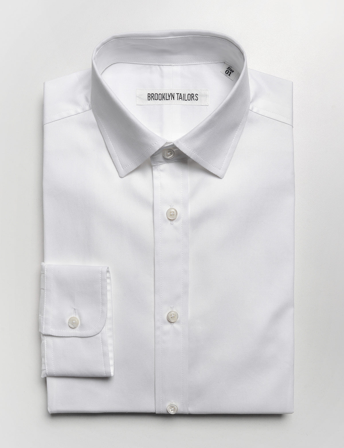Brooklyn Tailors BKT20 Slim Dress Shirt in Pinpoint Oxford - White folded flat shot