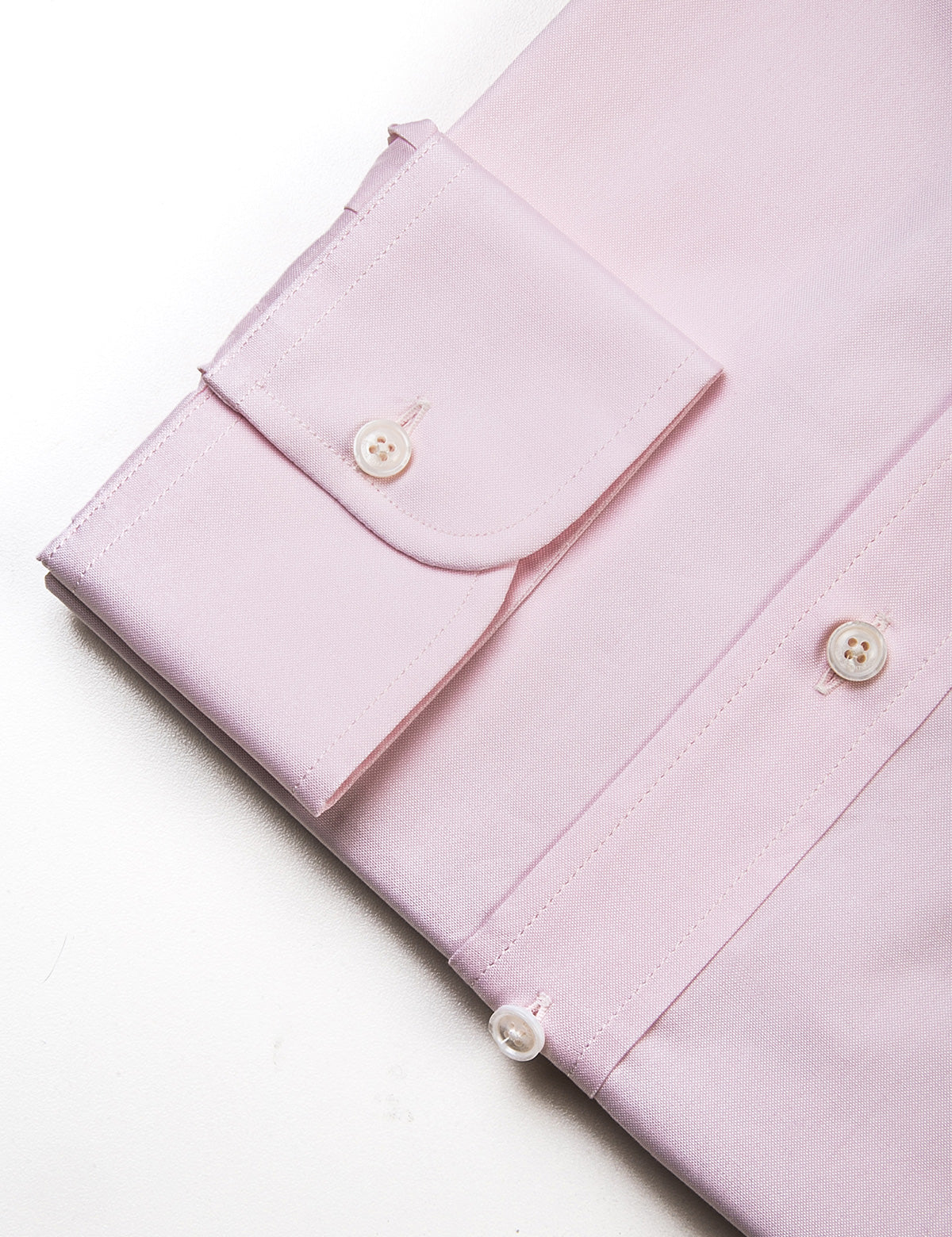 Detail of cuff, buttons, and fabric texture on Brooklyn Tailors BKT20 Slim Dress Shirt in Pinpoint Oxford - Pale Pink