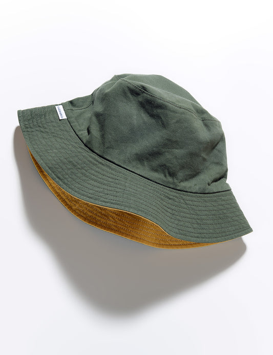 Flat shot of Cableami Reversible Cotton Bucket Hat - Olive/Lemon on the olive side