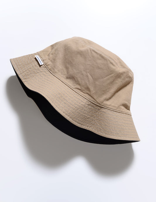 Flat shot of Reversible Cotton Bucket Hat - Navy/Beige on the beige side