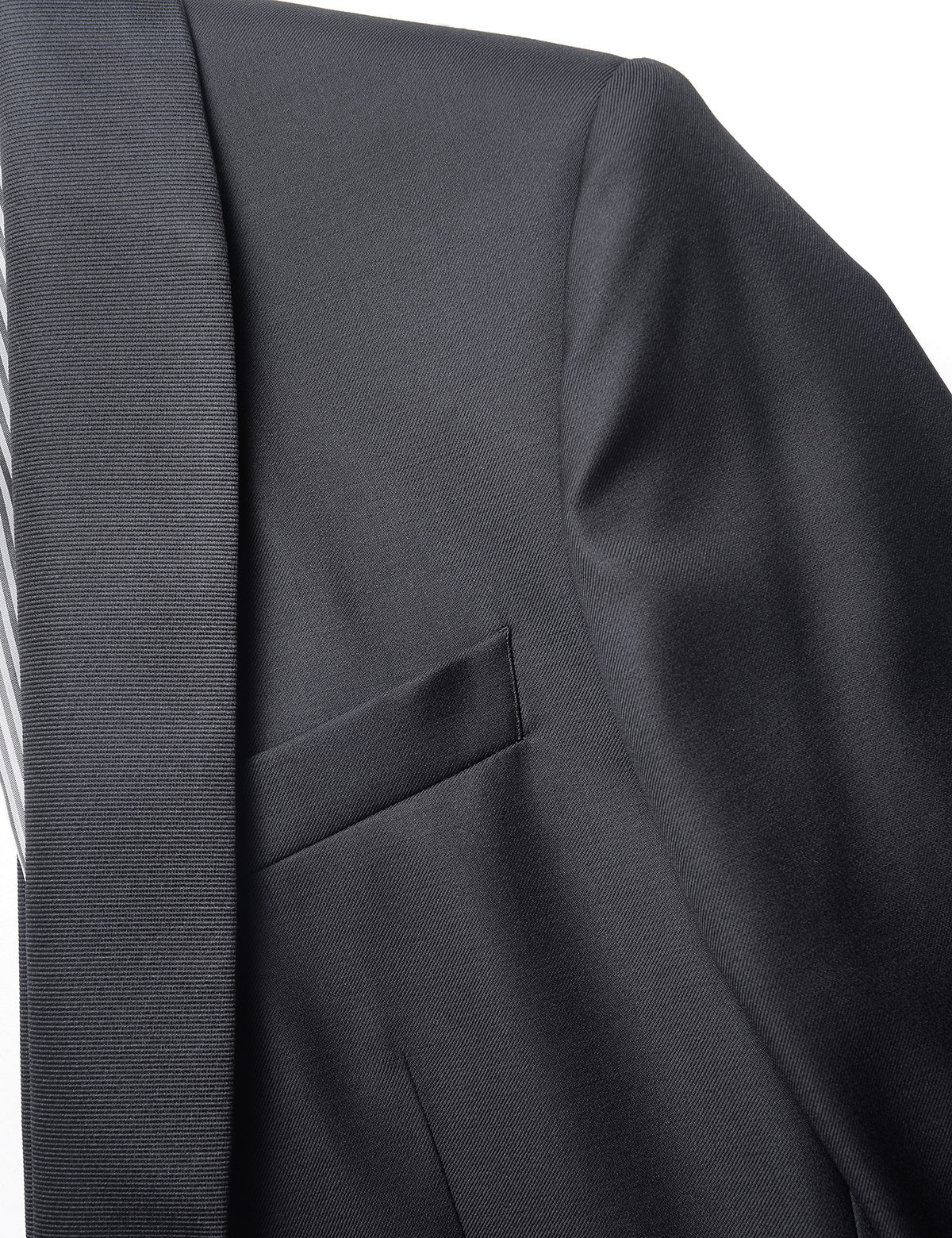 Detail shot of Brooklyn Tailors BKT50 Shawl Collar Tuxedo Jacket in Super 120s Twill - Black with Grosgrain Lapel showing lapel and pocket