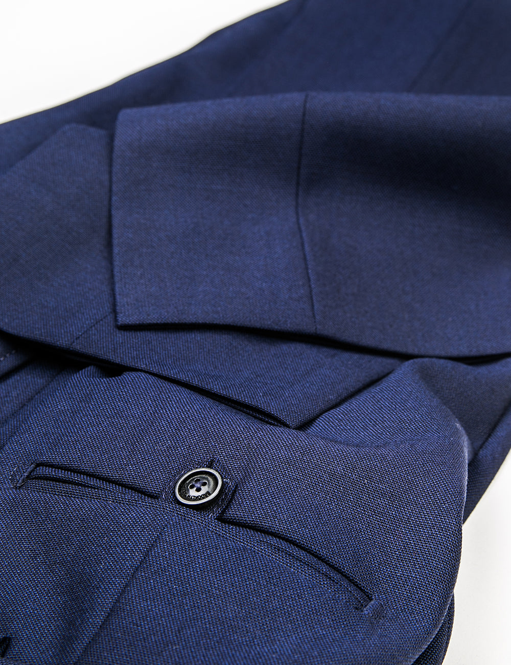 Detail shot of BKT50 Tailored Trouser in Travel-Ready Wool - Vivid Navy showing back pocket and hem