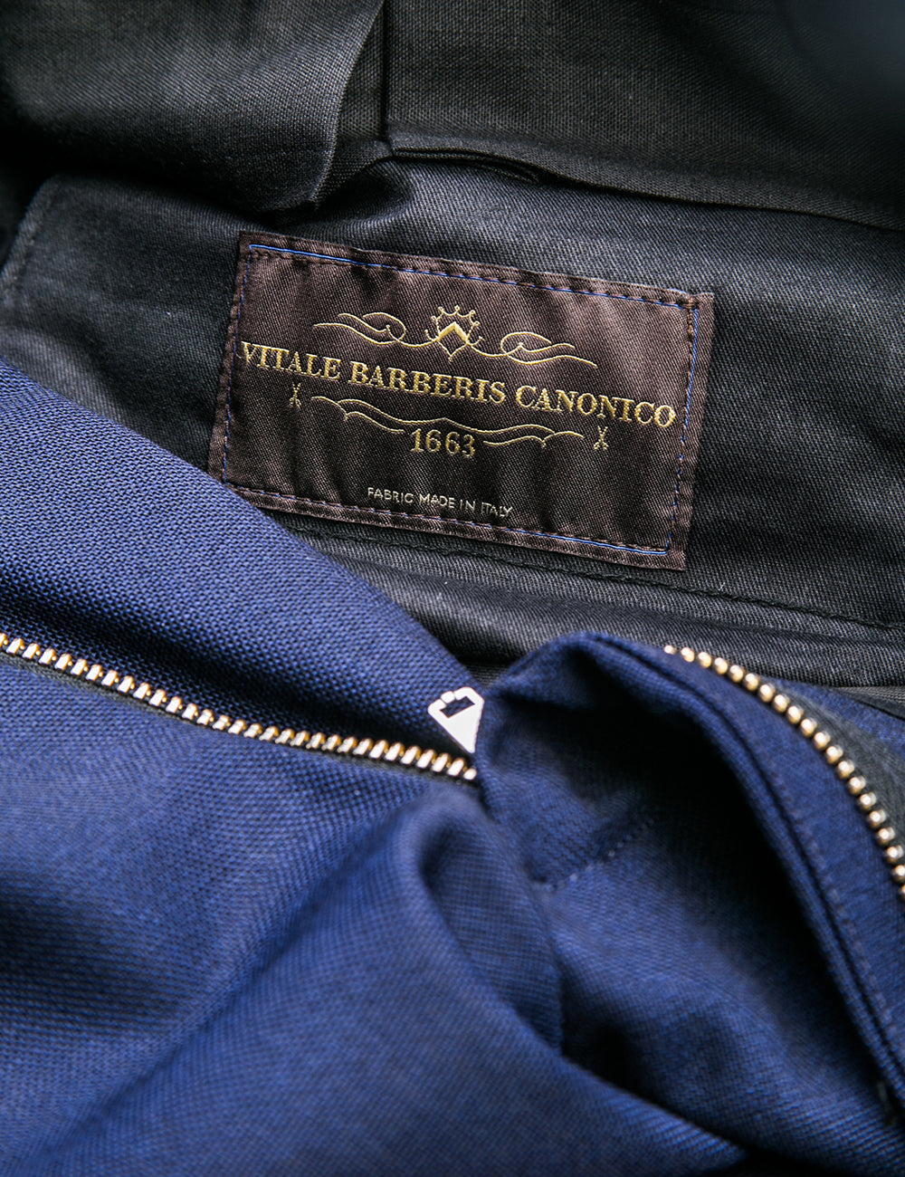 Detail shot of BKT50 Tailored Trouser in Travel-Ready Wool - Vivid Navy showing interior lining and label