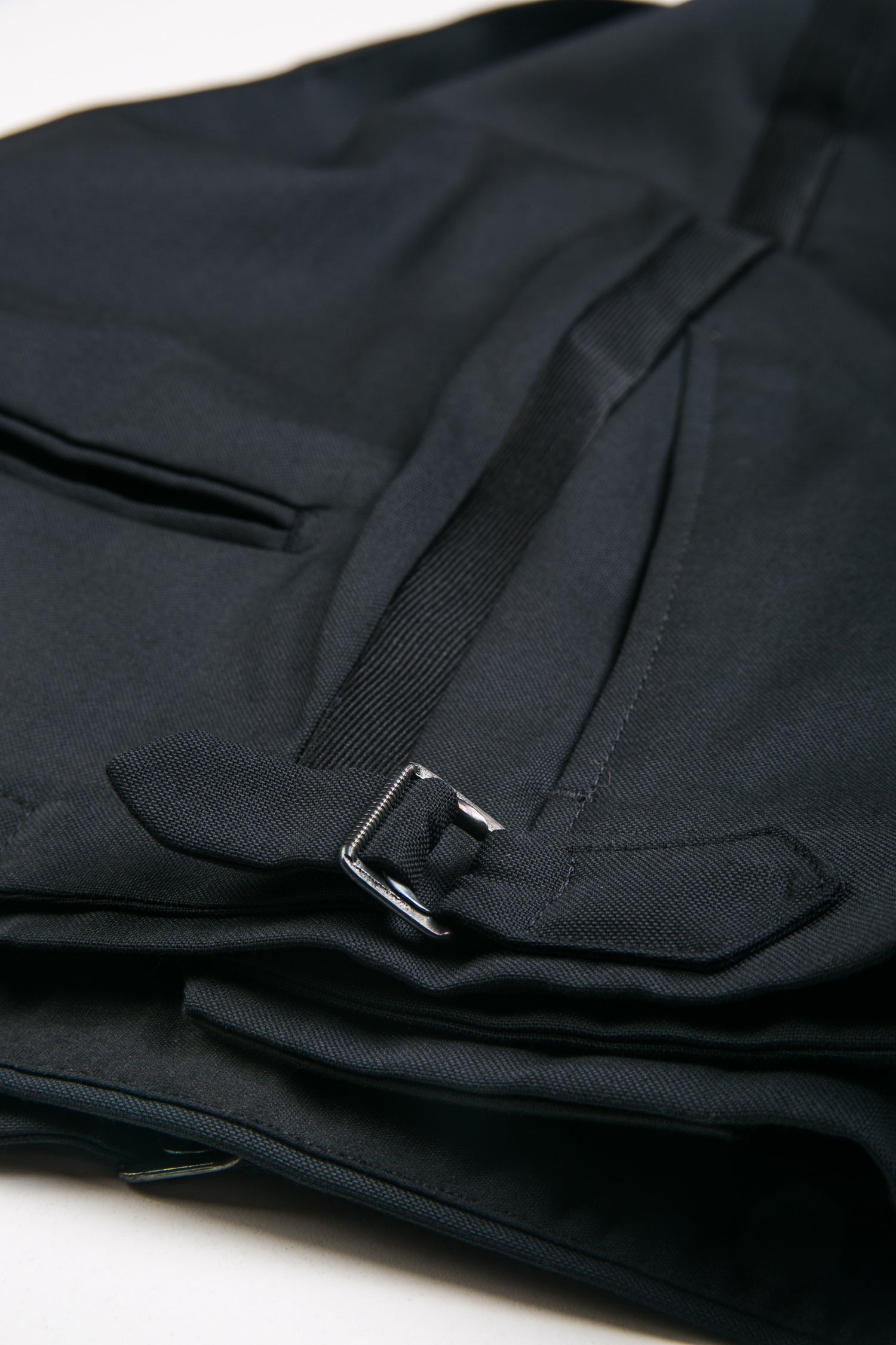 Close up of BKT50 Tuxedo Trouser in Super 110s - Black with Grosgrain Stripe showing side adjuster