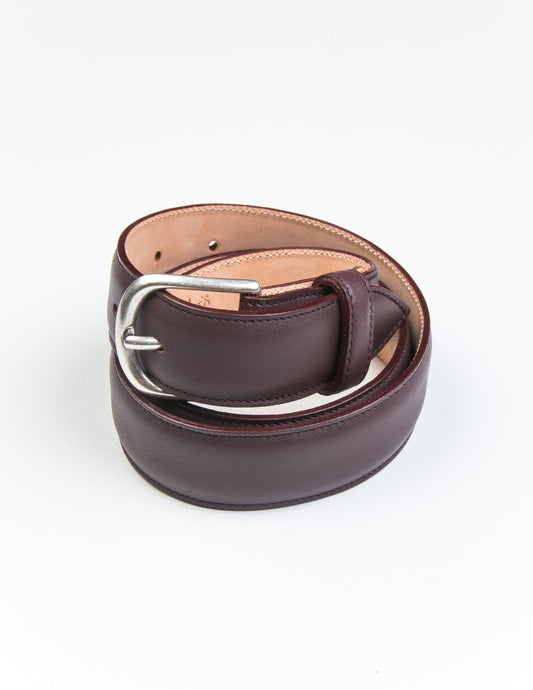 Shot of Brooklyn Tailors x Saddler's 30mm Belt in Smooth Leather - Bordo coiled up.