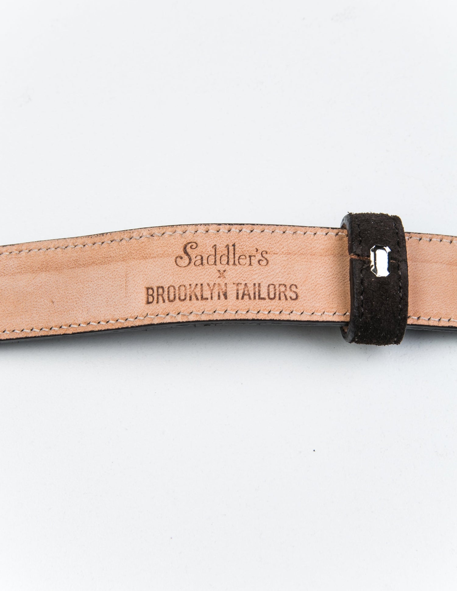 Detail of the Saddler's x Brooklyn Tailors x Saddler's stamp on the underside of 25mm Belt in Suede Leather - Deep Brown