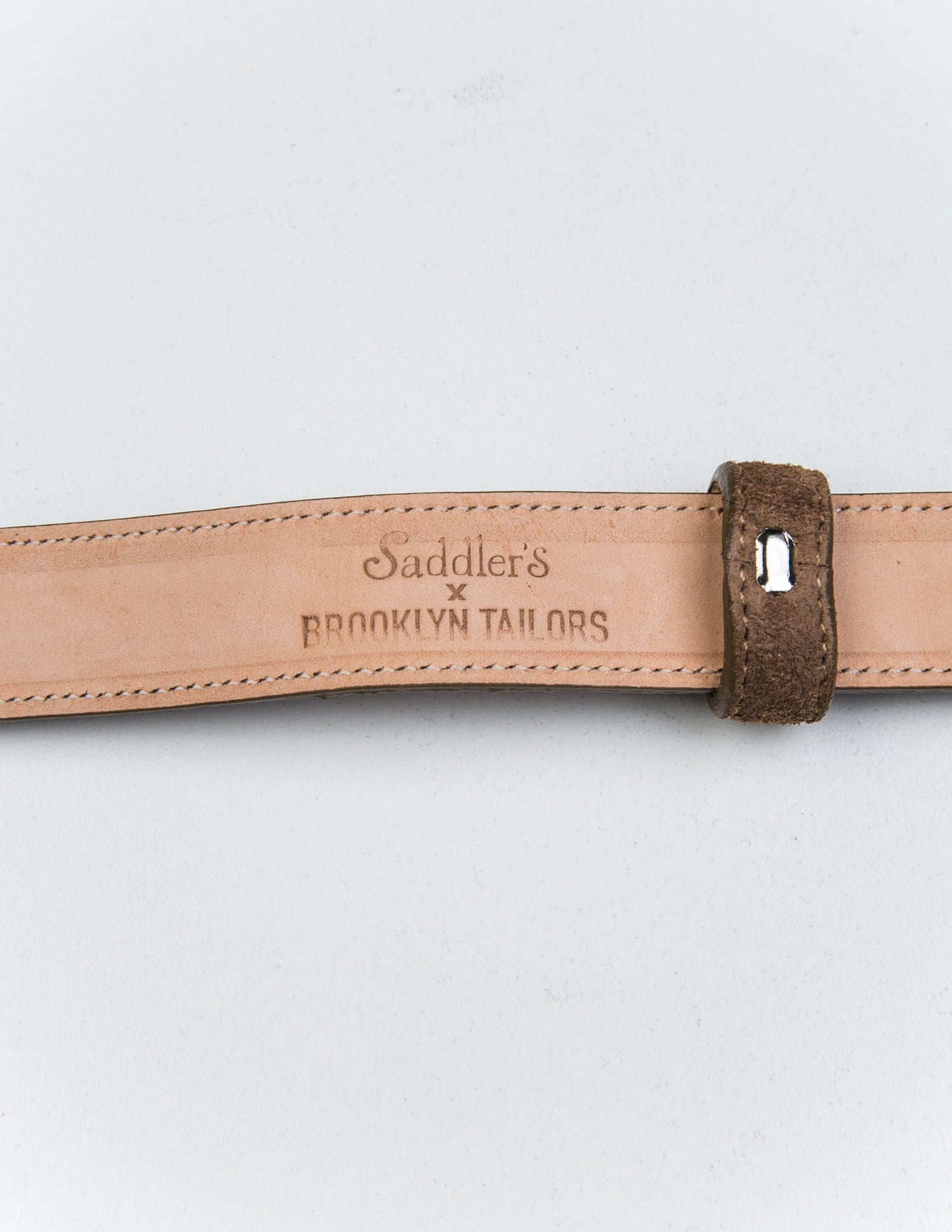 Detail of the Saddler's x Brooklyn Tailors stamp on the interior of 25mm Belt in Suede Leather - Clay