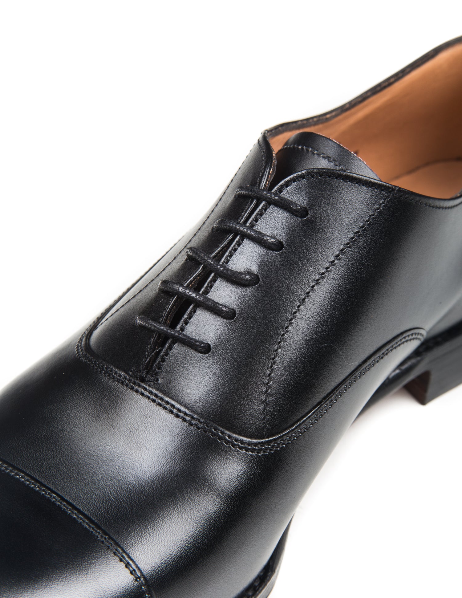 Close up of Lime Oxford Shoes in Black Calf Leather showing stitching and laces