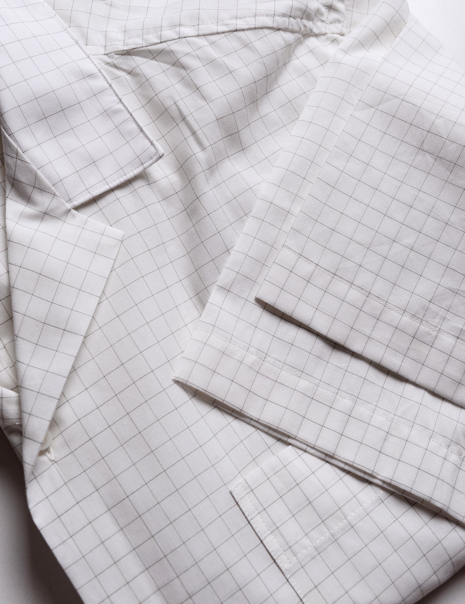 Detail of camp collar and sleeve on Brooklyn Tailors BKT18 Camp Shirt in Cotton Silk Graph Check - Natural