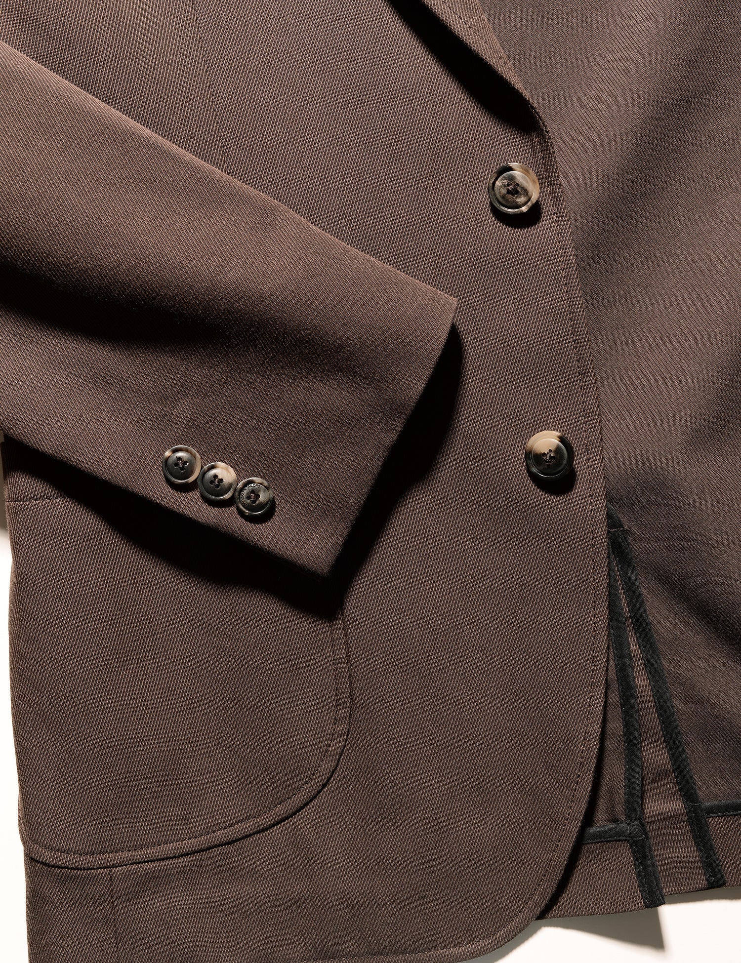 Detail of BKT35 Unstructured Jacket in Cavalry Twill - Rosewood showing cuff and patch pocket