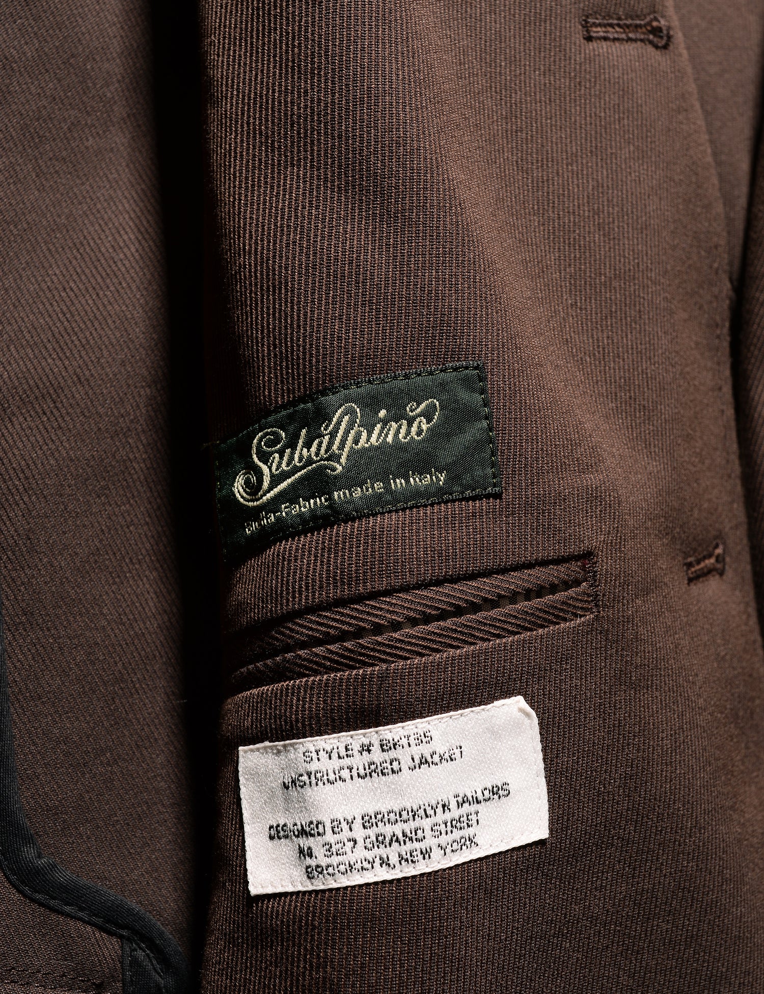 Detail of BKT35 Unstructured Jacket in Cavalry Twill - Rosewood showing Subalpino label on interior panel