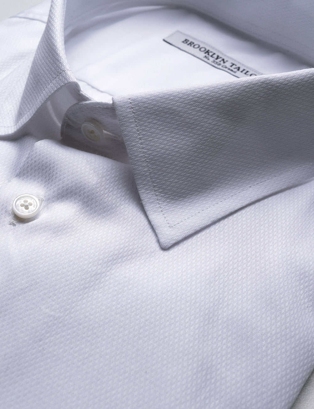 Detail of French Cuff Tuxedo Shirt With Removable Buttons - White Dobby showing fabric texture and collar