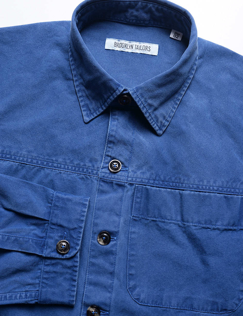 Detail of collar, buttons, placket, and pocket of Brooklyn Tailors BKT15 Shirt Jacket in Crisp Cotton - Washed Cobalt