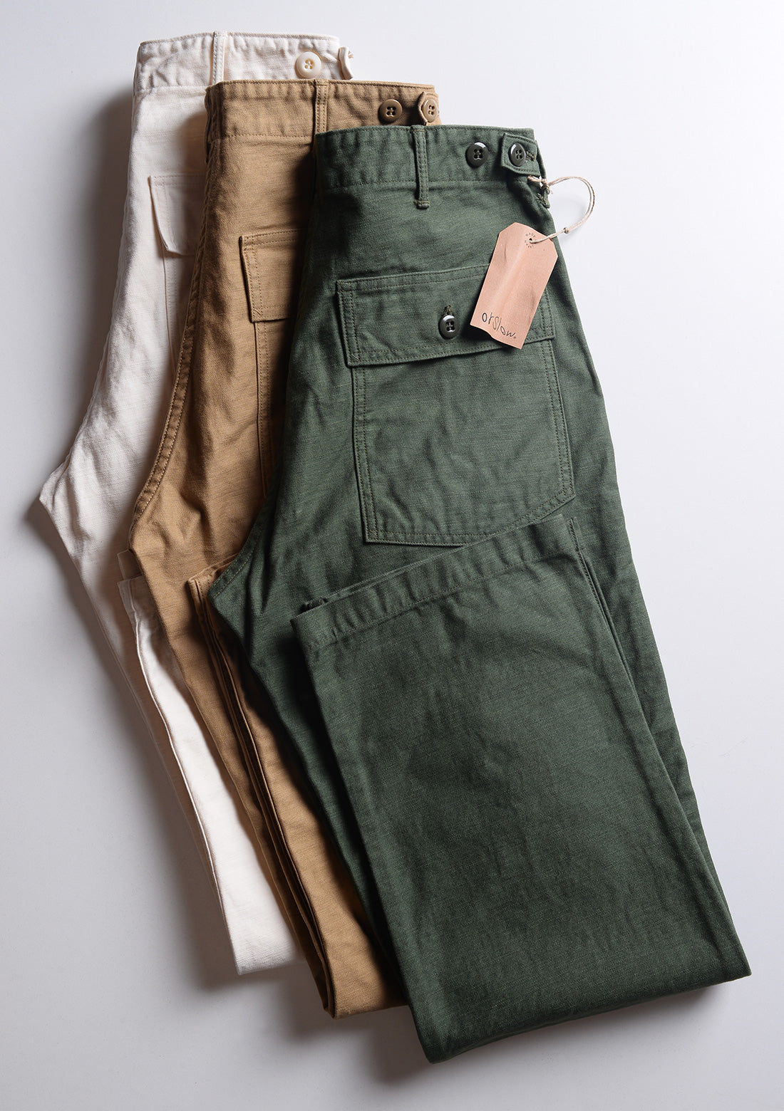 Folded detail of Orslow US Army Fatigue Trousers - Army Green showing back pocket and hem