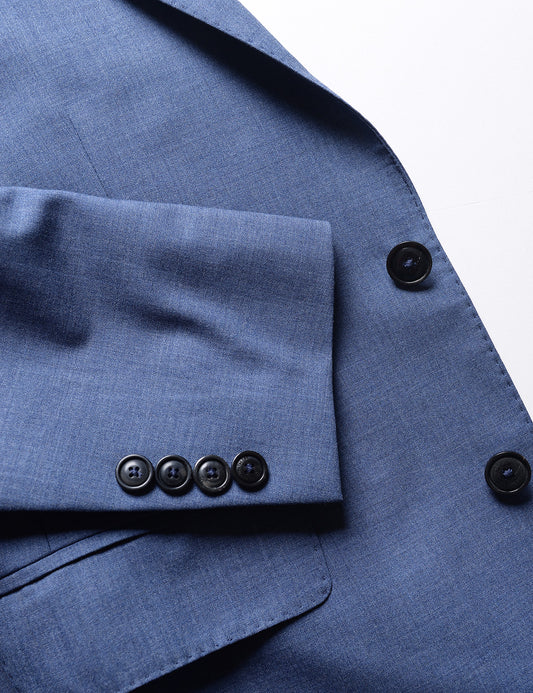 Detail shot of Brooklyn Tailors BKT50 Tailored Jacket in Heathered Wool - San Marino Blue showing cuff, pocket, and buttons