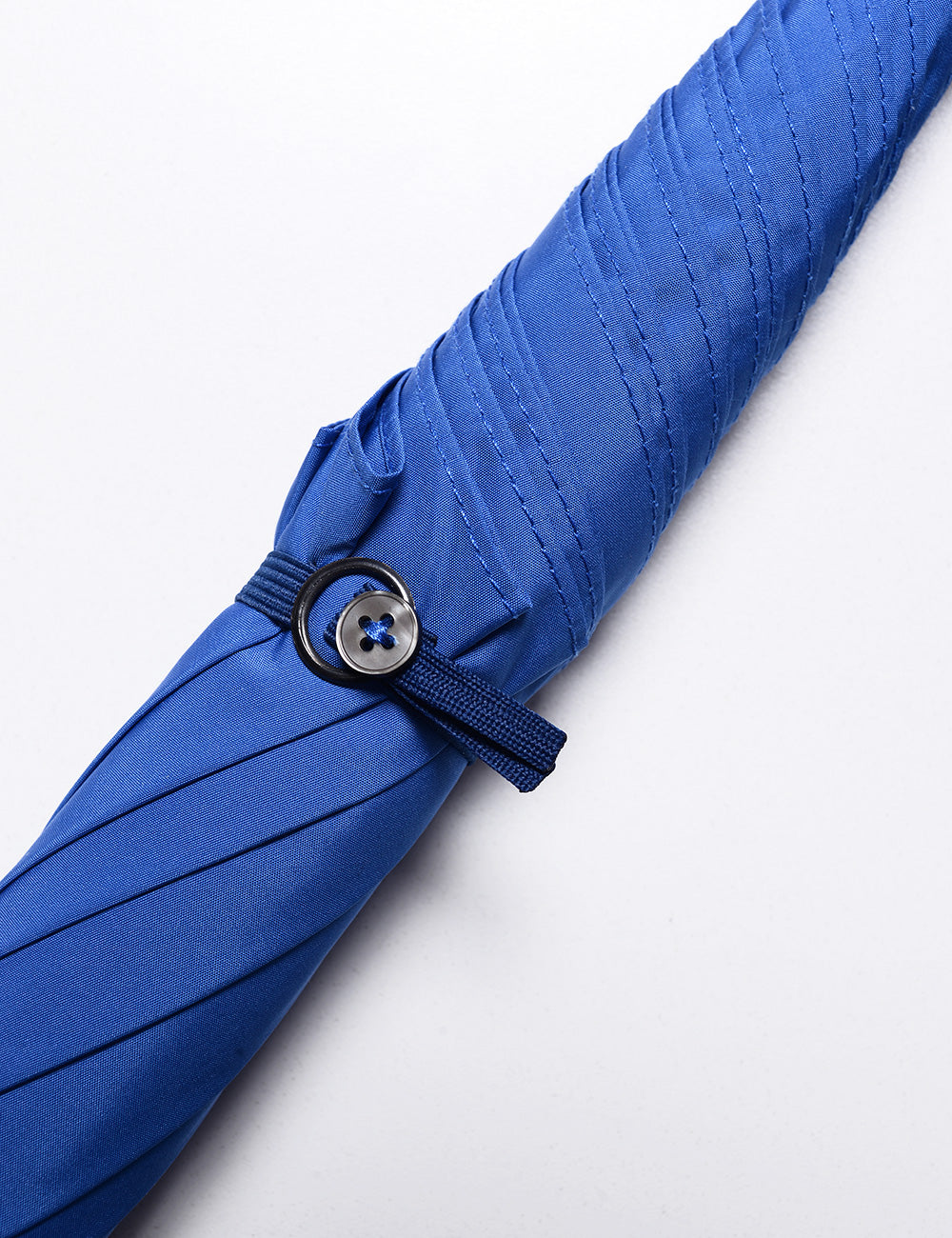 Button closure detail of GT1 Gentleman Tube Umbrella in Royal Blue
